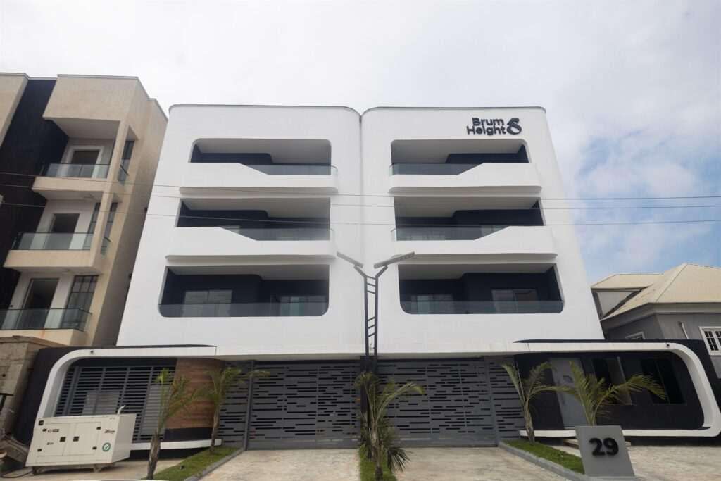 Brum Height 8: Front facade with recessed balconies and a gated entrance